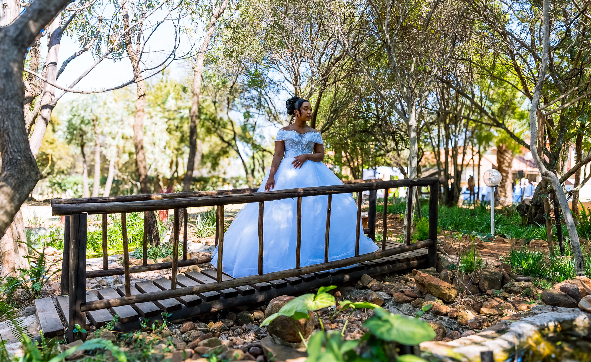 Musa and Chantal on the bridge in the garden